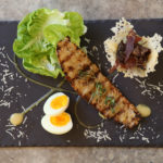 South African Caesar sals with cos lettuce, kudu biltong, a boiled egg and ciabatta and caeser dressing